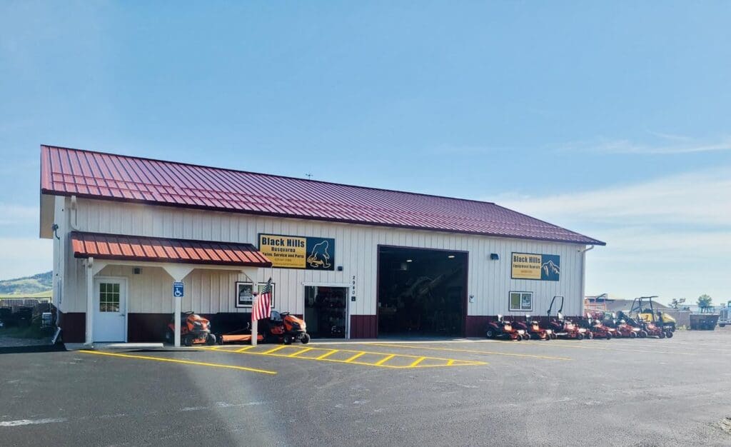 Exterior of Black Hills Equipment Rentals and Husqvarna dealership in Spearfish, SD, showing storefront, signage, and outdoor equipment display.