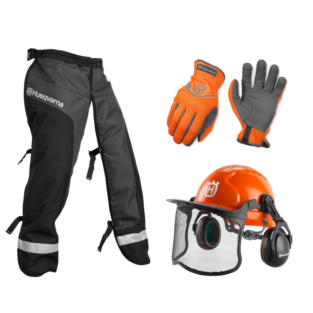 Husqvarna safety gear set including protective chaps, work gloves, and an orange helmet with face shield and ear protection.