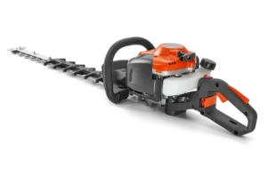 Husqvarna hedge trimmer with long dual-action blades and orange housing, displayed on a white background.